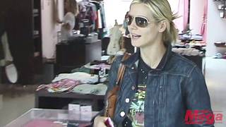 Heidi Klum out shopping on Robertson Blvd while husband Seal waits