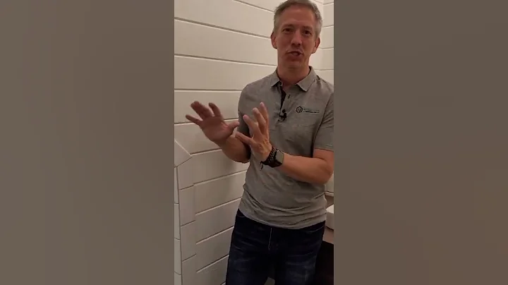 This tiny bathroom utilizes extra space in a garage loft, creating a unique and functional feature!