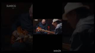 Mark Knopfler, Brian Johnson and Carlos Santana performing "Black Magic Woman" (Peter Greene)
