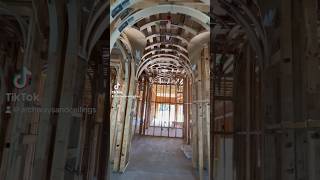 Beautiful wine gallery hallway loaded with a prefab groin vault & barrel ceilng carpentry drywall