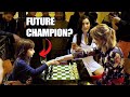 A little girl challenges a grandmaster at a chess bar in Paris