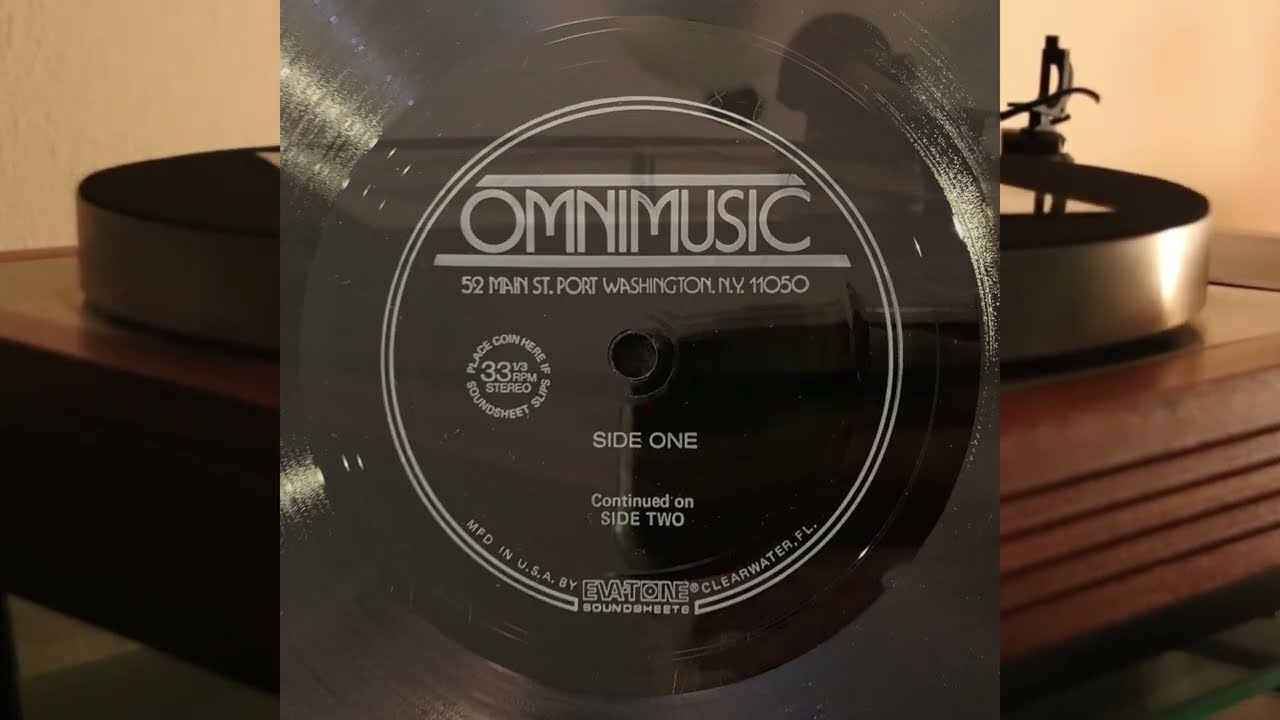 Omnimusic - Eva-Tone Soundsheet - vinyl lp - production music library sampler of Omnimusic catalog auf YouTube ansehen Omnimusic - Eva-Tone Soundsheet - vinyl lp - production music library sampler of Omnimusic catalog auf YouTube ansehen