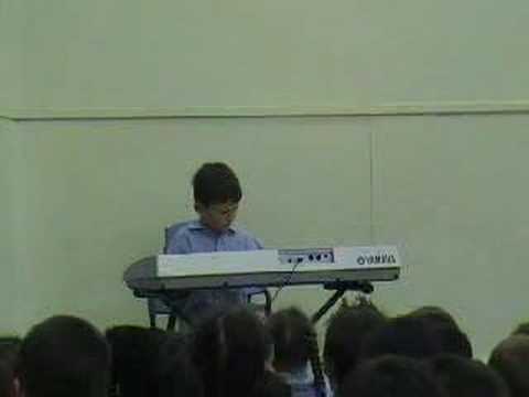 Thomas plays Piano at school assembly Twinkle Twinkle