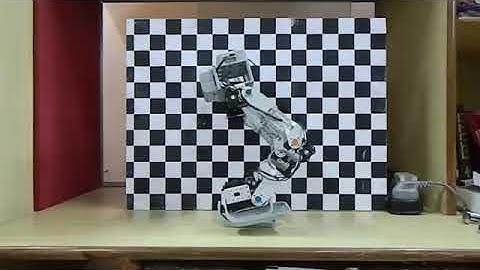 Energy optimal walk of an 8 DOF compliant biped robot