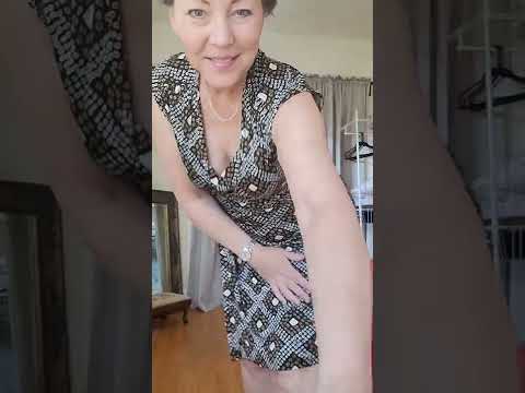 Mature woman prepares for swimsuit try on