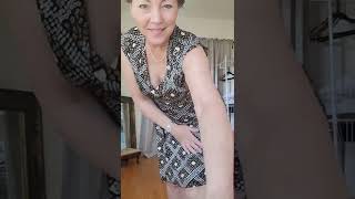 Mature woman prepares for swimsuit try on