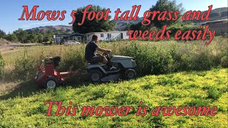 ATV flail mower cutting very tall grass and weeds
