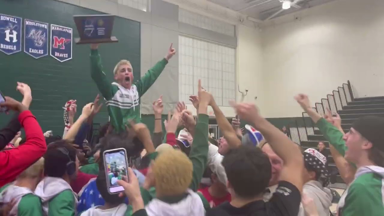 Matt Munson holding the trophy & celebration