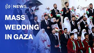 54 Palestinian couples celebrate mass wedding in Gaza amid ruins
