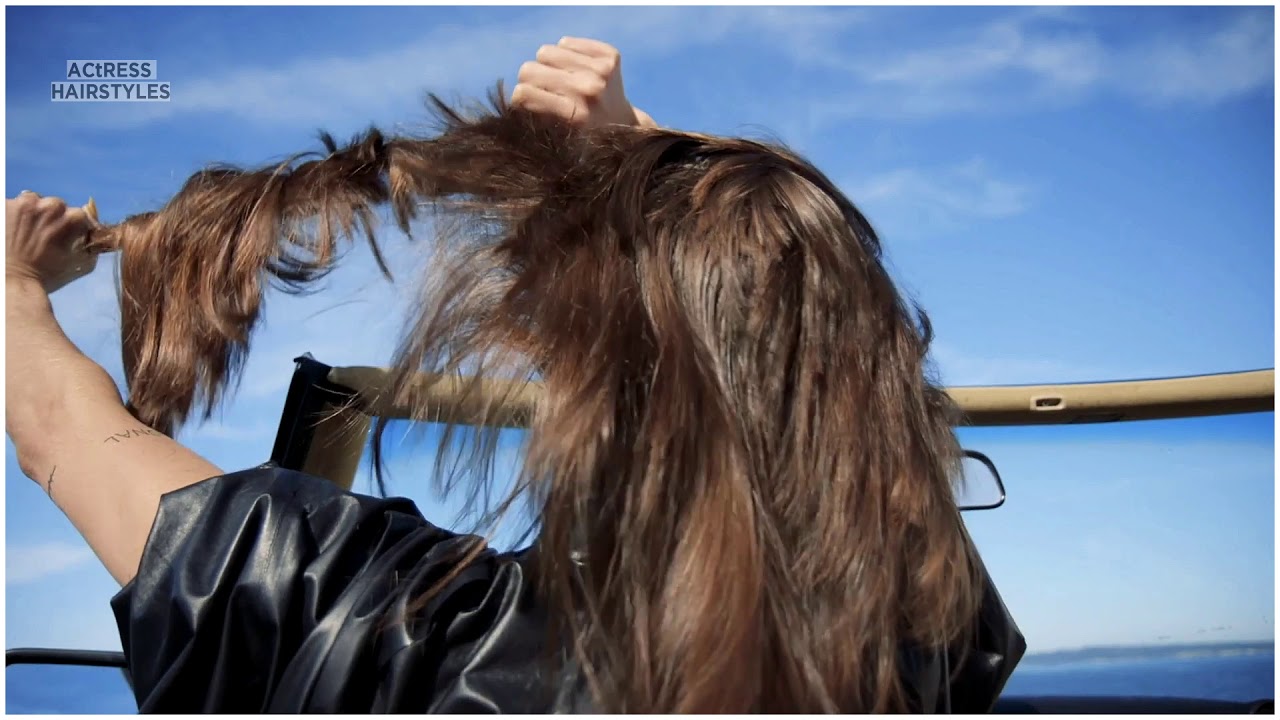 Woman cut her longhair in Music Vidoe