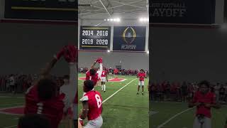 Jeremiah Smith, Brandon Inniss and Devin McCuin warm up before Ohio State’s practice