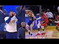 Steph Curry imitating Nico Mannion's behind-the-back dime from the bench