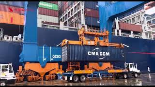 Bridge container crane lifts containers at a Vietnamese port