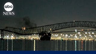 Moment a massive cargo ship crashes into and causes near-total collapse of Baltimore bridge