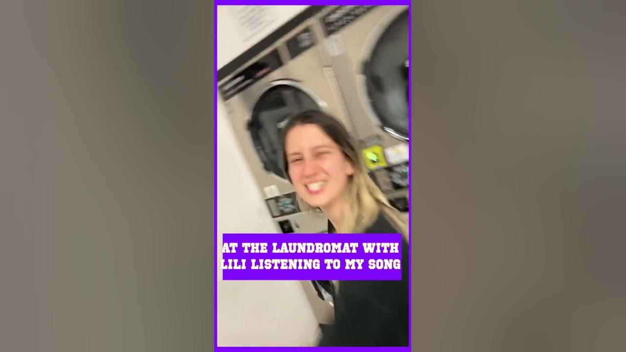 At the laundromat with Lili listening to my song Past Life  Having fun