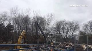 Payloaders Monday at Harbour Landing condo complex in New Haven to demolish building damaged in 12/2