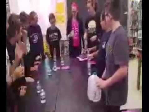 Students flipping bottles at St. Ignatius Loyola Regional School