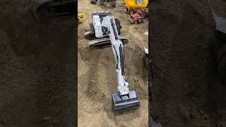 Massive hydraulic RC excavator digs into the dirt with ease
