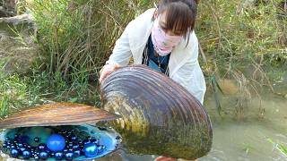 👍👍 Shadows wrap river depths as she unearths gems in a long-slumbering mysterious giant clam