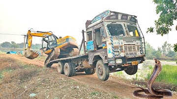 Excavator Machine Self Load Unload a Trailer Truck in a Different Way Experienced Excavator Operator