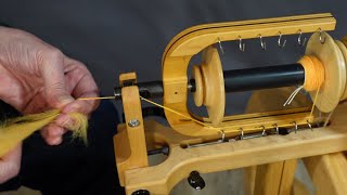 Learn how to spin on a spinning wheel.
