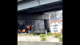 Flames errupt from car after fatal crash off Boston ramp