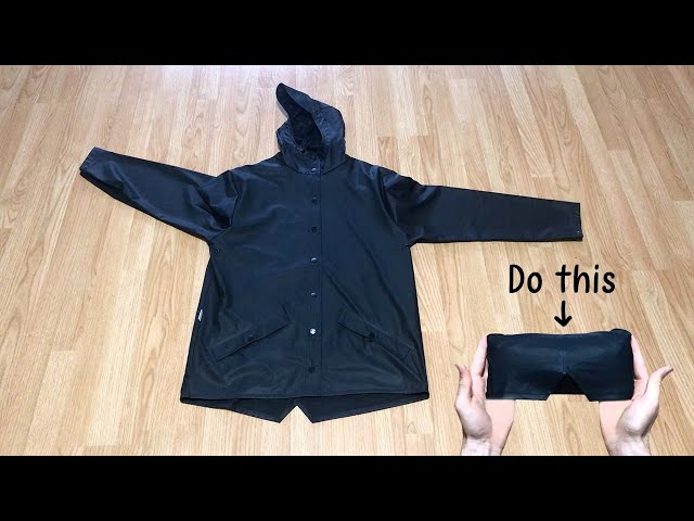 How to roll a rain jacket for packing (step-by-step).