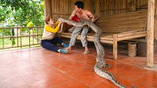Father and Daughter Catching a Wild Python Alive After it Crawled into The Daughter's bed