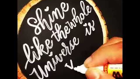 Modern calligraphy on a wood panel