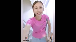 The Beautiful Woman Is An Amputee, Living With One Leg And Walking With One Crutch