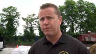 Inmates help prep sandbags as officials watch