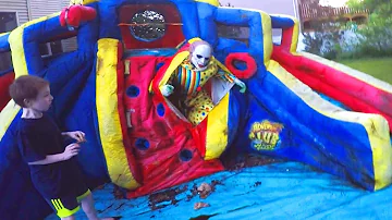 Scary Clown Attacks Through Inflatable Water Slide!