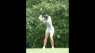 Three quarters of a backswing and start downswing. She is Linn Grant.