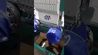 Вышивка на бейсболках на многоголовочной вышивальной машине tajima