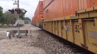 BNSF Gevo 7832 leading a stack/tofc train while being chase