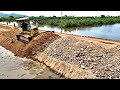 Amazing road construction komatsu dozer pushing stones to make more hight on the road