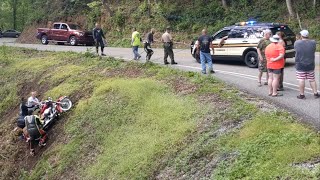 Tail of the Dragon police and Tennessee Highway Patrol pull motorcycle out of gulch.