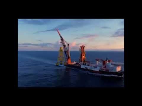 Heerema Aegir sailing with offshore wind jacket at the hook