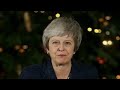 British PM Theresa May speaks after surviving confidence vote