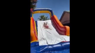 Man Flops When He Jumps Off The House Roof Onto A Water Slide