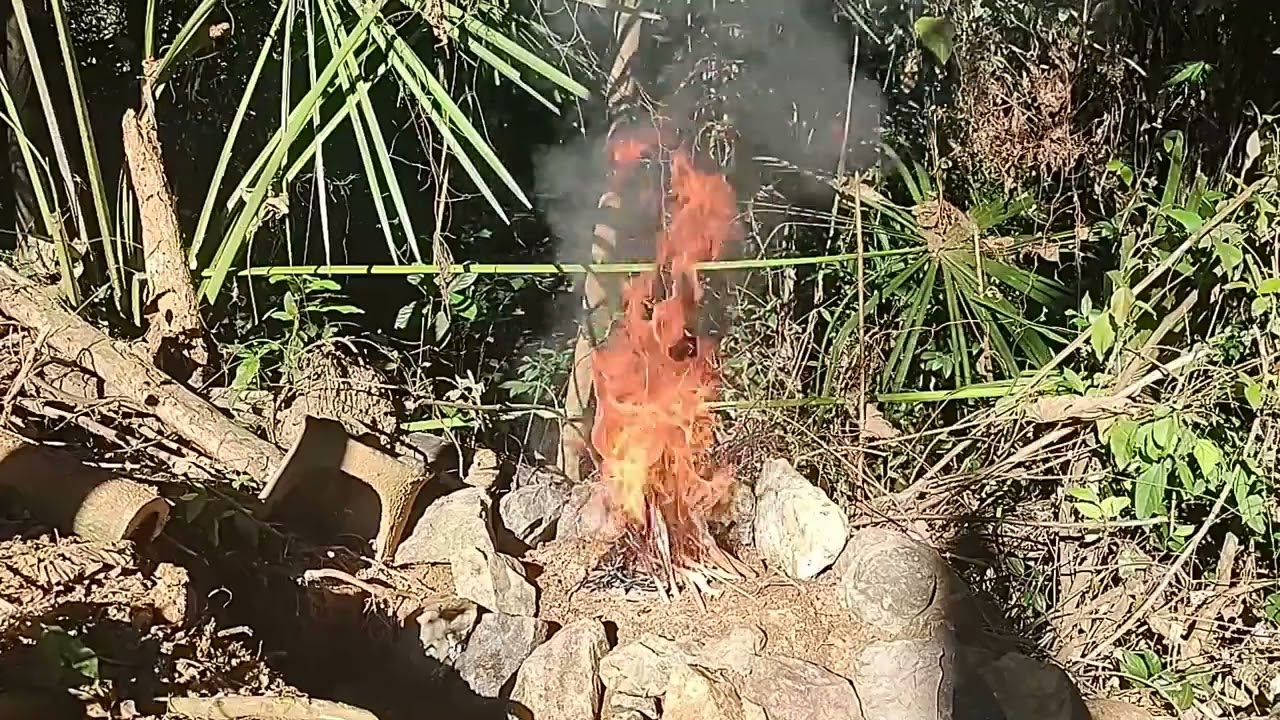 working in the killer heat building a new fire platform for a fatwood fire friday