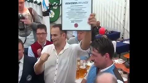 Thumbnail of German man sets a new world record by carrying 29 mugs of beer