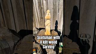 Scotsman with a kilt wood carving