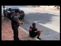 Video shows officer using stun gun on man sitting on sidewalk