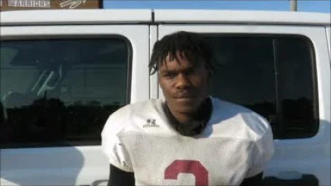 Russell County quarterback Robert Calhoun does his...