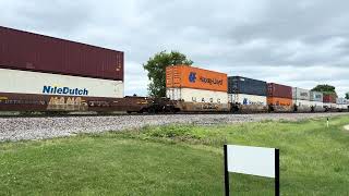 Westbound CPKC 149 racks and stacks with CP 8024 mid train KCSM 4733 at Duplainville on 6/14/26