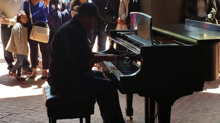 Man off street amazes audience on piano.