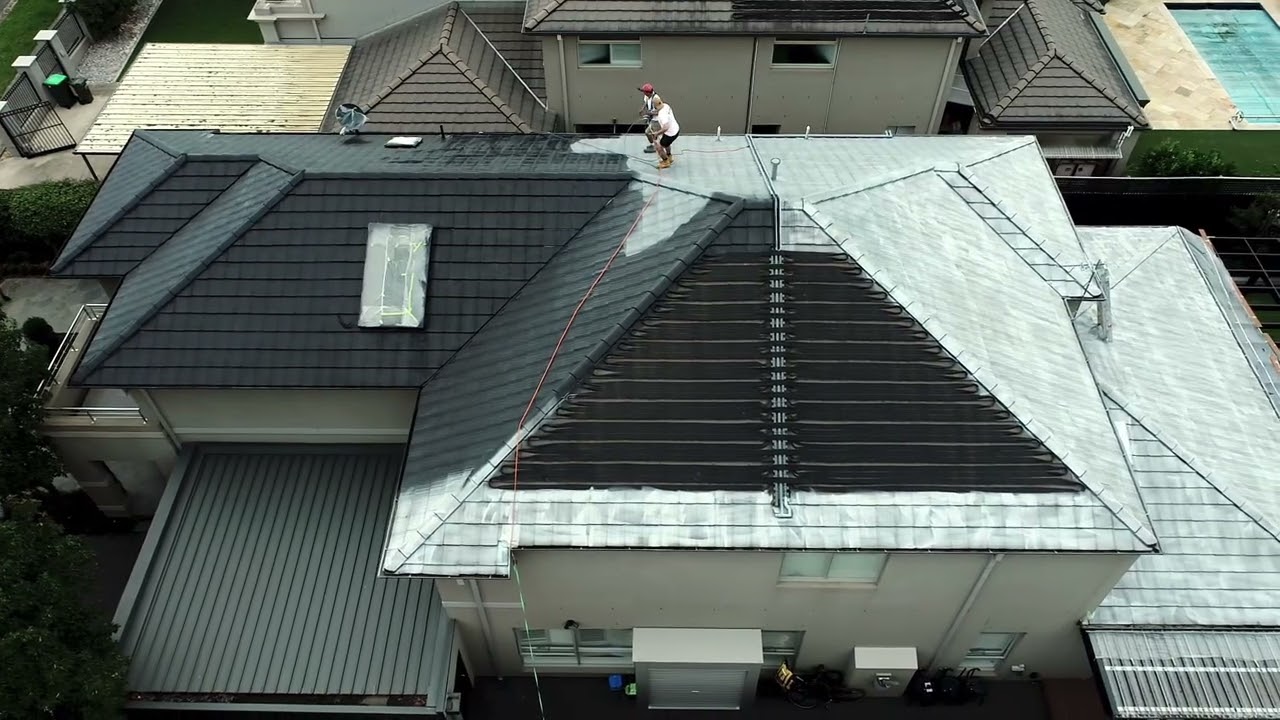 Mousi roof restoration in progress on a Melbourne tile roof — terracotta, tile and Colorbond roof painting