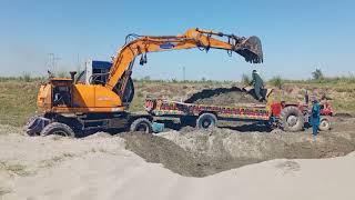 Excavator Catterpillar working at huge sand mining in river water||catterpillar excavator