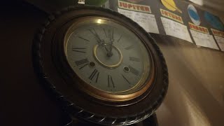 Japanese Regulator wall clock striking 11 PM in night time